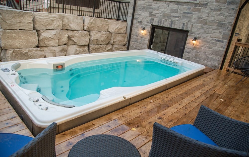installed in a wooden floor swimexpert swim spa