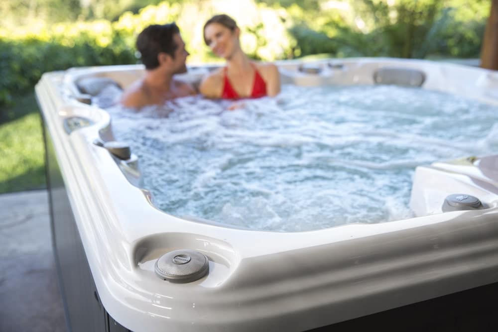 couple enjoying their time in sundance hot tub